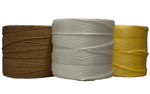 three different colored spools of thread